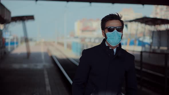 Businessman In Mask Protection Epidemic Coronavirus On Public Transport Station. Man Waiting Tram.
