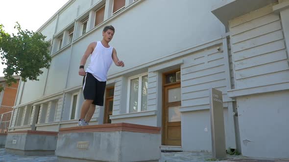Young athlete performing parkour trick