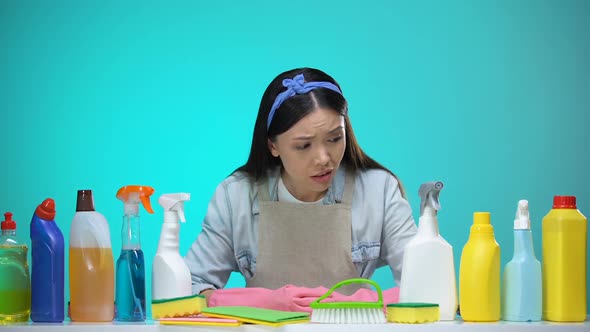 Confused Housewife Choosing Between Detergents, Eco-Friendly Cleaning Chemical
