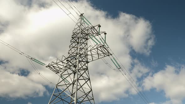 Transmission towers. Electricity pylons. High-voltage tower and wires against beautiful sky