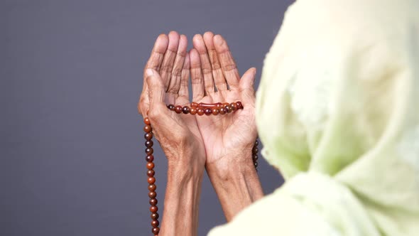 Rear View of Senior Women Hand Praying at Ramadan