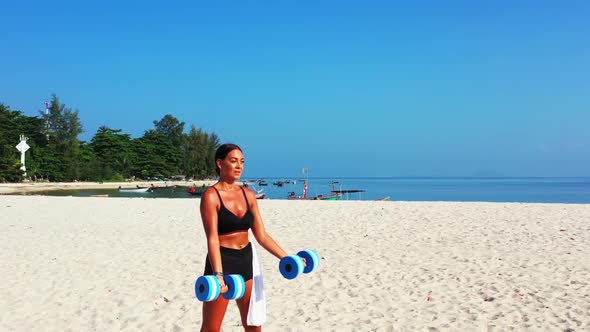 Beautiful women relaxing on tropical coastline beach holiday by blue sea with white sand background 