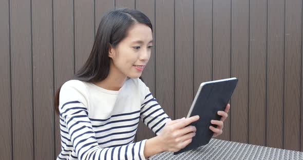 Woman use of tablet computer for online