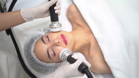 Young Asian Woman Getting Beauty Treatment at Dermatology Clinic