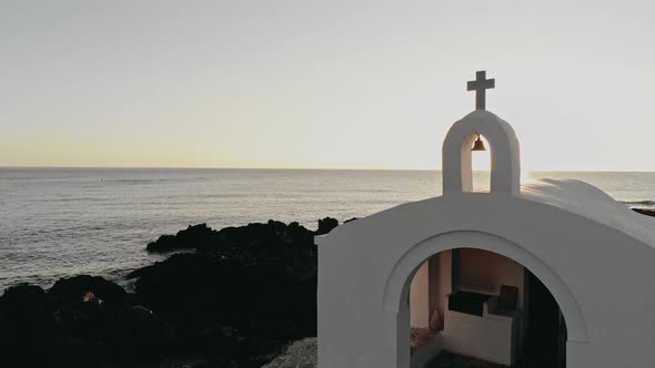 White Greek Church at Pink Sunset Seaside Filmed on Mavic II Pro
