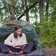 A Young Woman Inside a Tent in the Woods - VideoHive Item for Sale