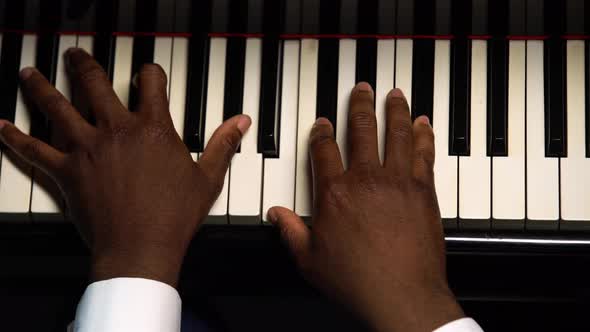 Top View of Male Hands Playing the Grand Piano