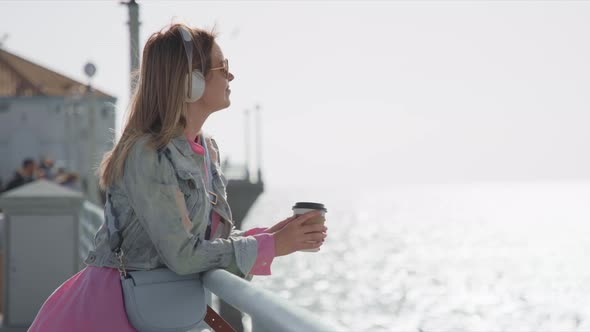 Happy Young Woman Dreaming with Beautiful Ocean View