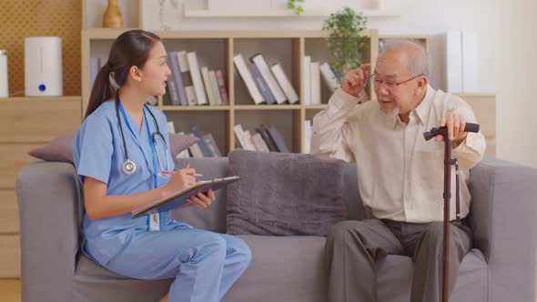 Asian doctor woman visited senior or elderly patient to diagnosis and check up health at home.Happy
