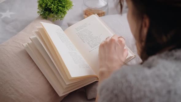 Young Woman Reading A Book