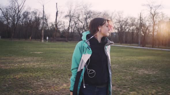 Portrait of Young Cute Attractive Young Girl in Park Background