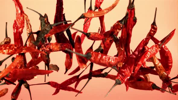 Dried Chili Peppers Fly Up and Fall Down