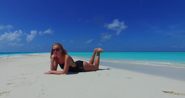 Young beauty models on vacation enjoying life on beach on summer white sand and blue background 4K