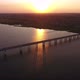 Aerial Shot of a Lengthy Bridge at Splendid Sunset From a High Flying Drone - VideoHive Item for Sale