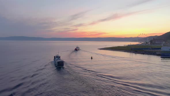 Aerial Footage of a White Excursion Boat on the Water of Lake