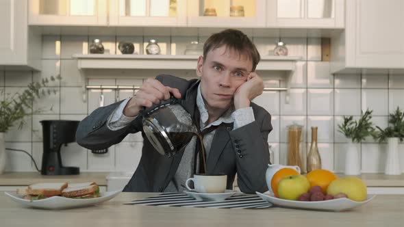 Cinemagraph of Tired Man Pouring Morning Coffee