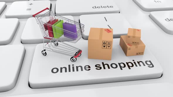 Shopping online via internet with shopping cart full with shopping bag and boxes