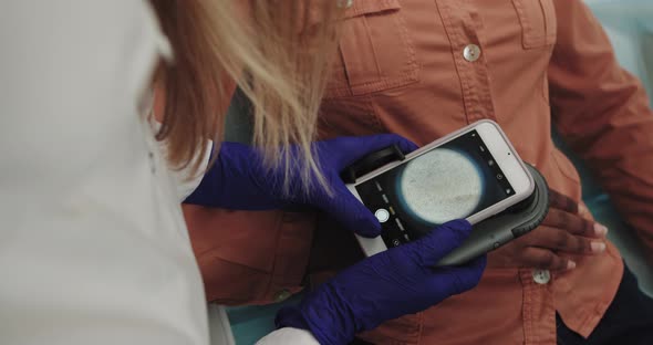 Dermatologist Examines A Skin