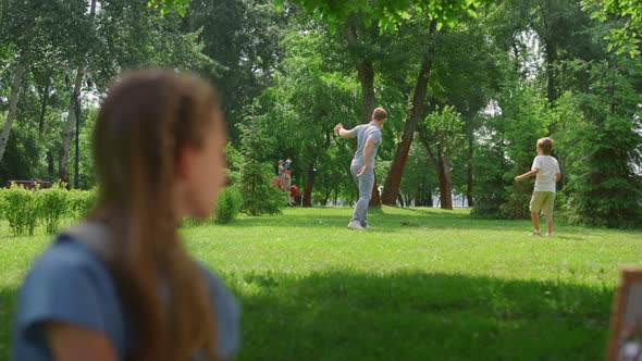 Profile Girl Watching Soccer Game in Park