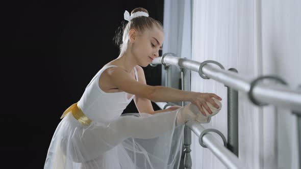 Teen Caucasian Ballerina Girl Teenager Dancer Child Student in Dance Hall Doing Choreographic