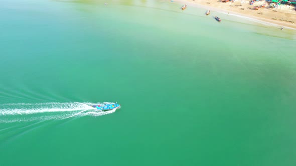 4K aerial view of drone, fishermen's boats are sailing towards the shore.