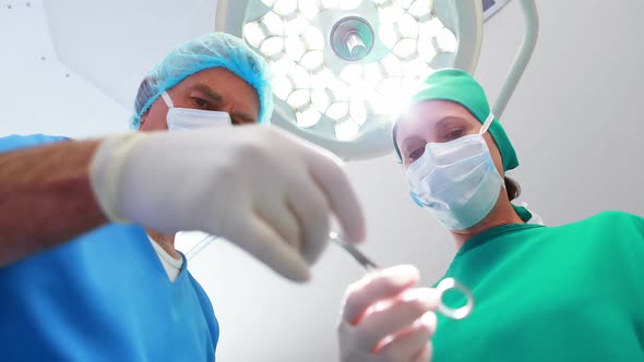 Surgeons performing operation in operation theater