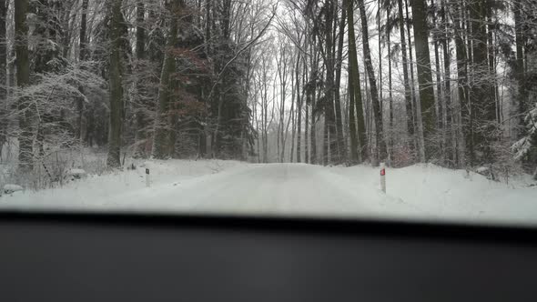 Snowing On The Road. Car driving on snow road