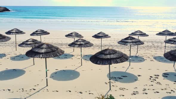 Paradise Beach for Relaxation with Umbrellas Near the Sea Sunny Weather