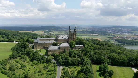 Banz Abbey in lush summer landscape, Upper Franconia, Germany