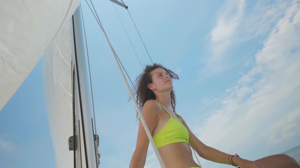 Sexy Woman Tanning on Yacht Enjoying Warm Sunlight