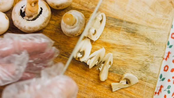 The Chef Cuts the Mushrooms with a Professional Knife