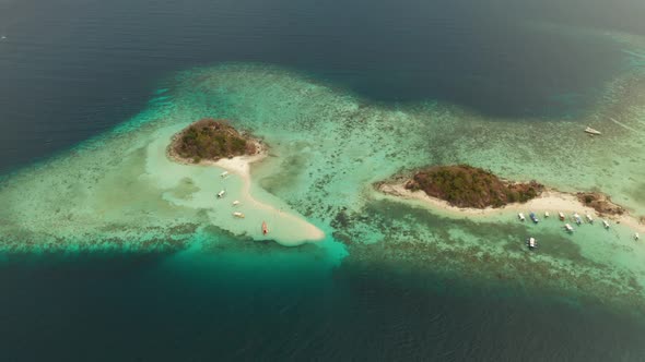 Small Torpic Island with a White Sandy Beach Top View