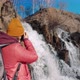 Woman Takes Photo of Waterfall - VideoHive Item for Sale