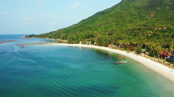 Chaloklum Bay, Koh Phangan, Thailand, Peaceful lagoon with boats, sandy beach and palm forest