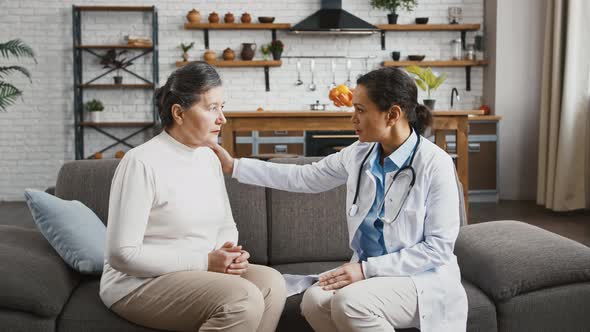 Female Doctor Telling Elderly Patient About Illness She Has and Kind of Tests She Should Pass