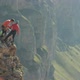 A Group of Climbers Discussing a Plan of Action Standing on the Edge of the Cliff - VideoHive Item for Sale