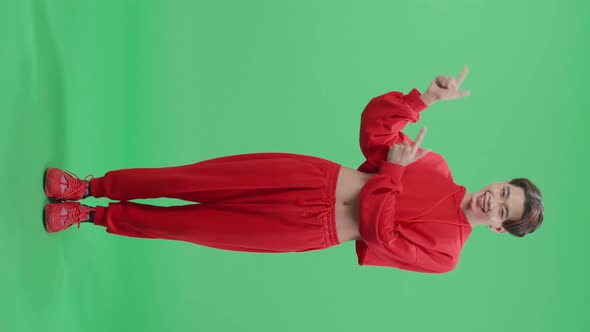 Full Body Of Asian Transgender Male Smile And Pointing To The Side While Standing On Green Screen