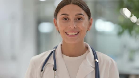 Portrait of Serious Female Doctor Doing Online Video Chat