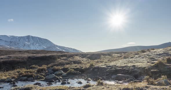 Mountain Meadow Timelapse at the Summer or Autumn Time. Wild Nature and Rural Valley. Sun Rays