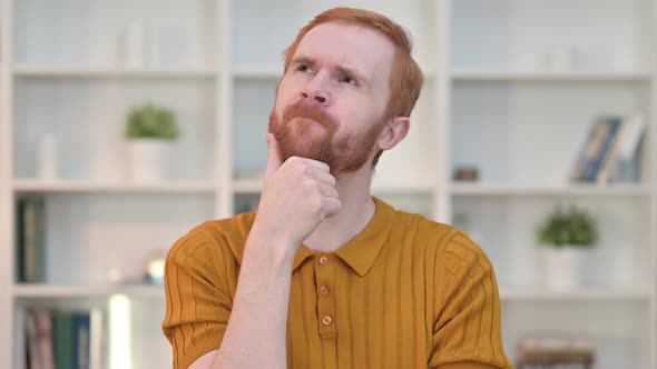 Portrait of Redhead Man Thinking and Getting Idea