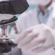 Researcher scientist using microscope to work in biotechnology laboratory medicine science biology - VideoHive Item for Sale