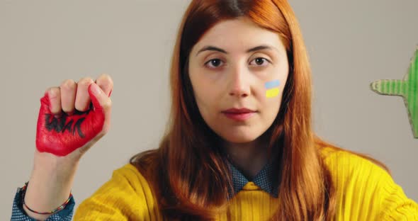 Russia with Planes and Girl Protesting Stop War in Ukraine on the Hand