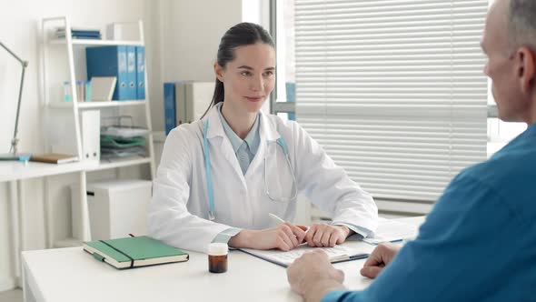 Female Doctor Having Conversation with Male Patient