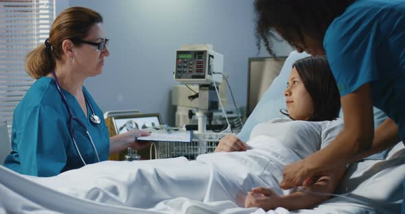 Doctor Visiting Patient in Hospital