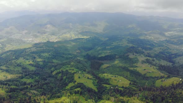 Aerial Drone View Mountains Covered with Green Grass and Green Trees. View of the Mountain Tops