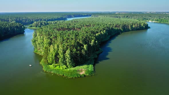 Big island on lake in Poland, aerial view