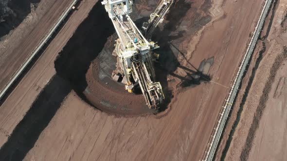 A Large White Bucketwheel Excavator in a Coal Mine Aerial View