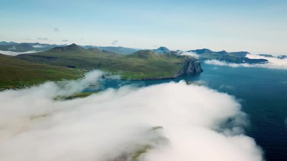 Aerial View of a Slave Cliff Hidden in the Mist Faroe Islands