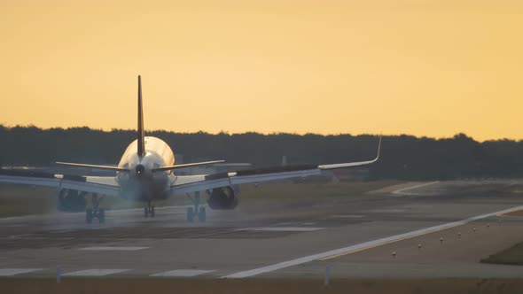 Airplane Landing at the Early Morning