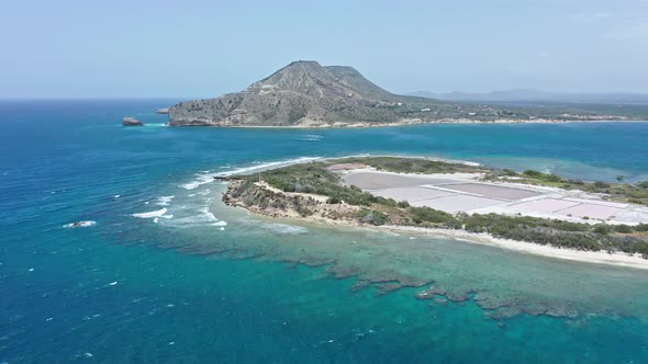 Scenic tropical key (Isla Cabra) in Caribbean, El Morro in background; aerial